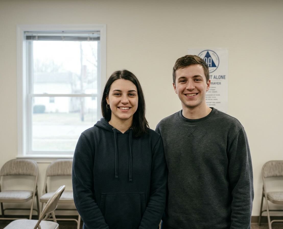 Two people talking at an AA meeting in Michigan
