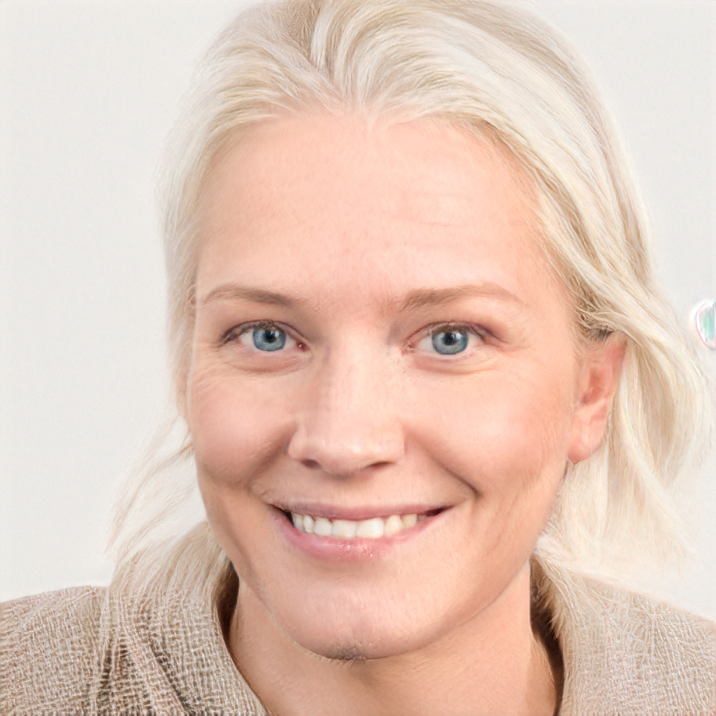 Authentic headshot of a smiling woman on a neutral background
